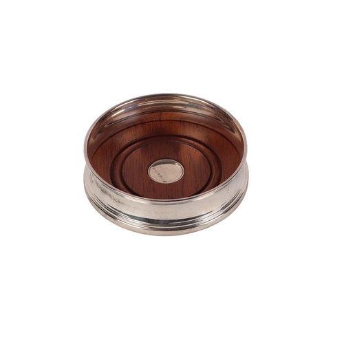 428 - A Carrs silver and mahogany wine bottle coaster, 10cms diameter, boxed.