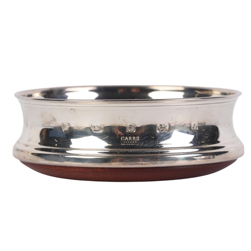 428 - A Carrs silver and mahogany wine bottle coaster, 10cms diameter, boxed.