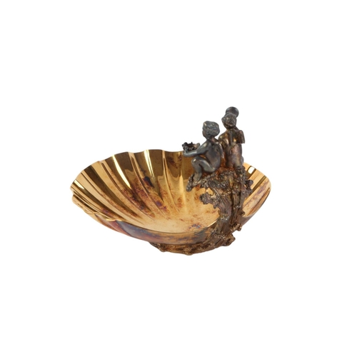 432 - A silver gilt shell shaped dish with winged cherub decoration, London 1982, produced by Aurum to com... 