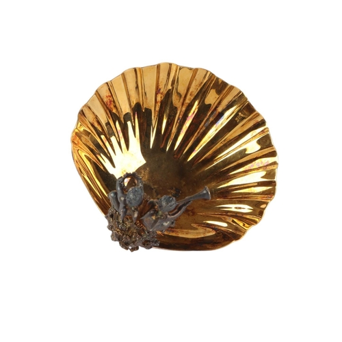 432 - A silver gilt shell shaped dish with winged cherub decoration, London 1982, produced by Aurum to com... 