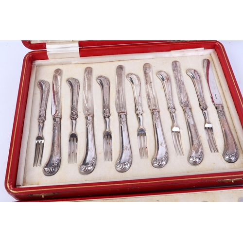 453 - A cased twelve-piece setting silver handled dessert cutlery with pistol grips, initialled 'H'.