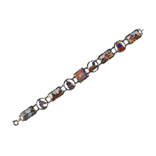 466 - A continental silver and enamel Egyptian Revival panel bracelet, 19cms long, 15.7g.