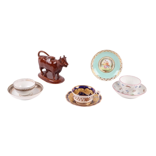 48 - A small collection of 19th century ceramics including a tea bowl and saucer decorated with sprays of... 