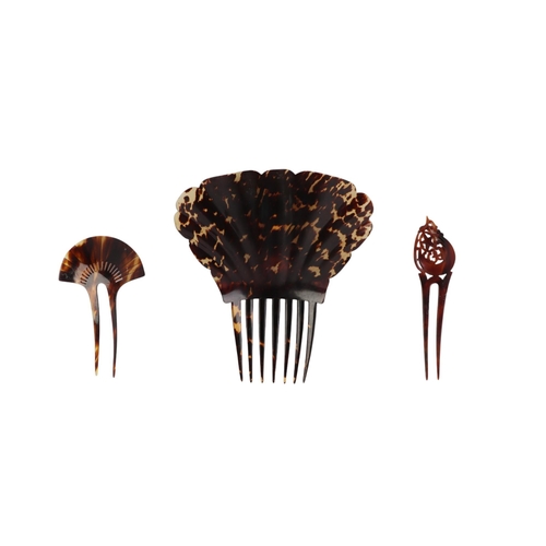 488 - An antique tortoiseshell hair comb, 19cms high ; together with three smaller similar (4).