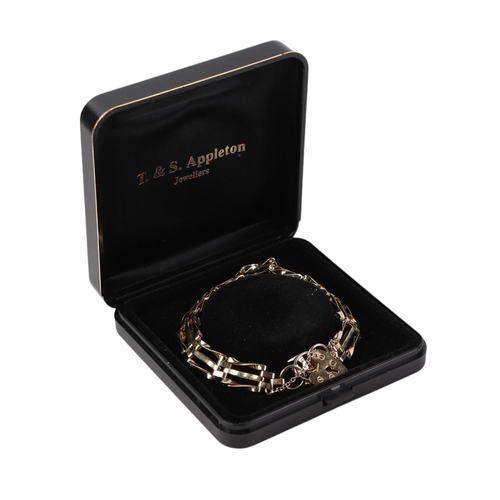 496 - A gold plated bracelet with padlock clasp.