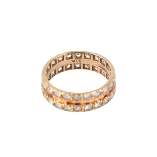 500 - A 9ct gold eternity ring set with a double band of white stones, possibly white sapphire, approx UK ... 