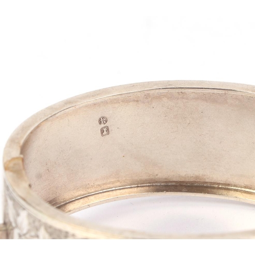 515 - A Victorian silver hinged buckle bangle, Birmingham 1884, 32g.