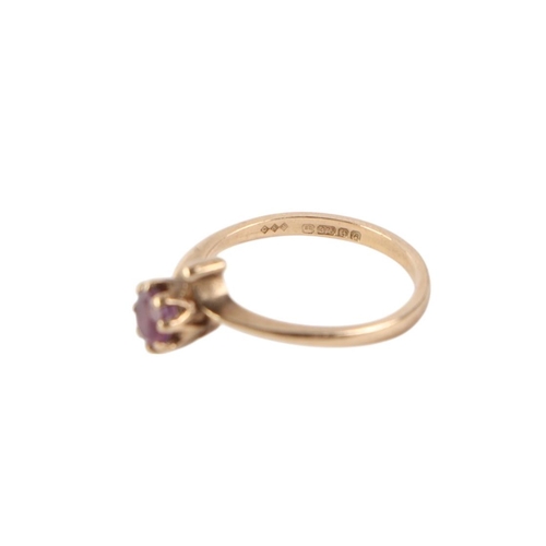 520 - A 9ct gold ring set with a single amethyst, approx UK size L, 1.7g.