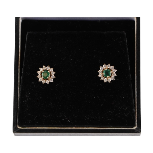 525 - A pair of 14ct gold diamond and emerald cluster earrings, boxed, 2.4g.