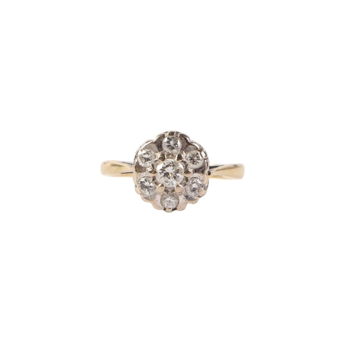 531 - An 18ct gold diamond flowerhead ring, approx UK size O, 3.9g.