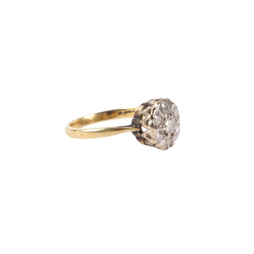 531 - An 18ct gold diamond flowerhead ring, approx UK size O, 3.9g.