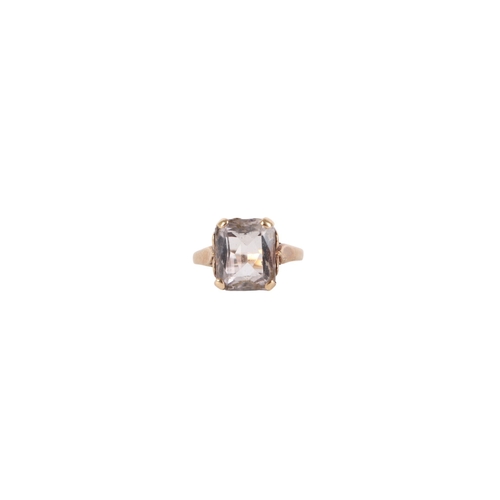 541 - A 9ct gold cocktail ring set with an emerald cut pale blue quartz, approx UK size L, 3.2g.