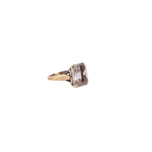 541 - A 9ct gold cocktail ring set with an emerald cut pale blue quartz, approx UK size L, 3.2g.