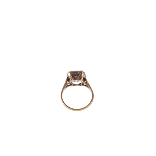 541 - A 9ct gold cocktail ring set with an emerald cut pale blue quartz, approx UK size L, 3.2g.