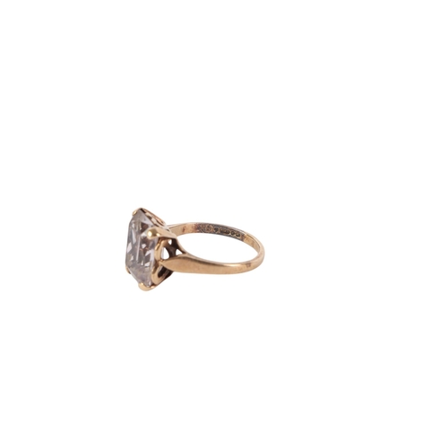 541 - A 9ct gold cocktail ring set with an emerald cut pale blue quartz, approx UK size L, 3.2g.