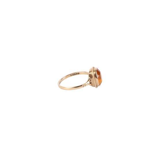 542 - A 9ct gold solitaire Citrine ring, approx UK size O, 2.1g.