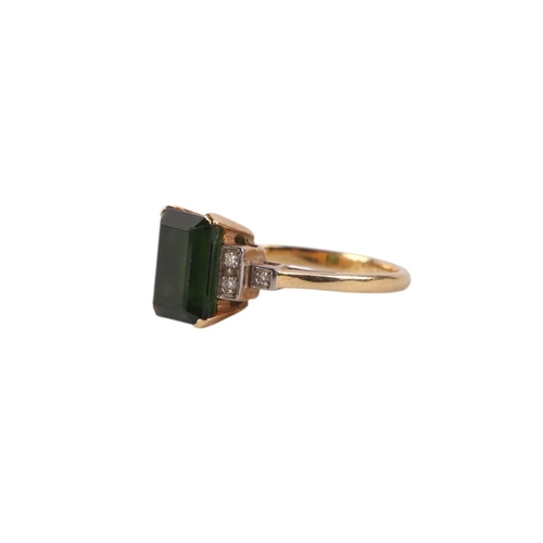 546 - An 18ct gold ring set with a large green stone and diamond set shoulders, approx UK size K, 3.5g.