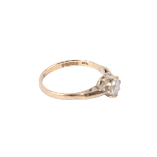 562 - A 9ct gold solitaire ring set with a white stone, a approx UK size M, 1.8g.