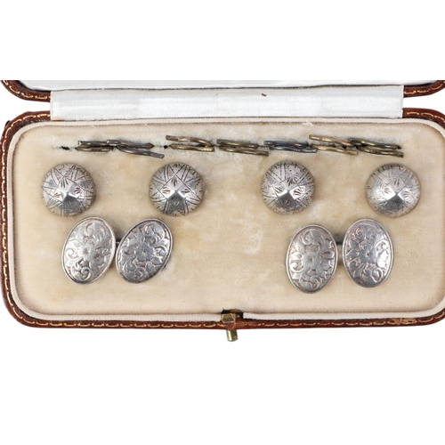 568 - A cased set of silver shirt studs and cufflinks, the cufflinks hallmarked for Chester and makers mar... 