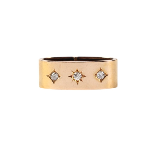 570 - A 15ct gold scarf ring set with three diamonds.