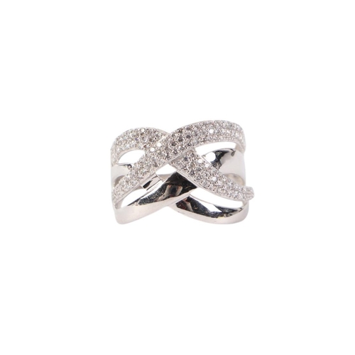 571 - A modern design 18ct white gold diamond set multi band ring, approx UK size M, 2.8g.