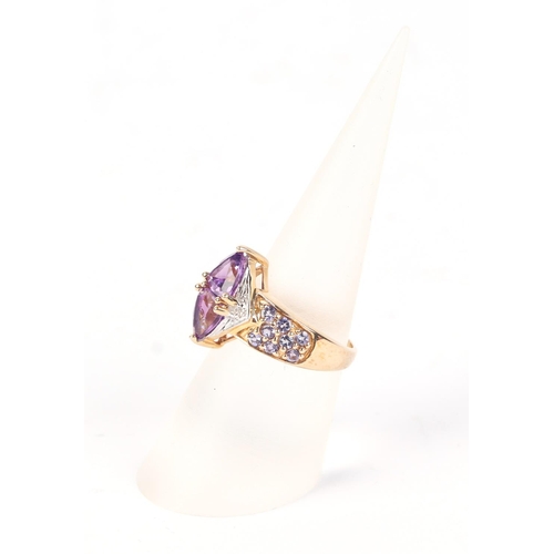 579 - A 9ct gold amethyst and diamond dress ring, approx UK size L, 4.2g.