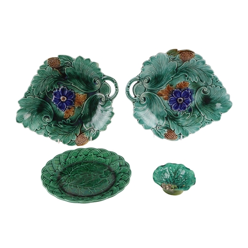 58 - A pair of majolica cabbage plates, 30cms wide; together with other majolica cabbage plates (a/f).