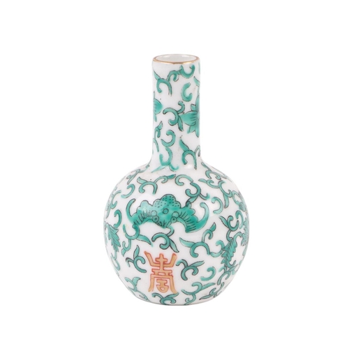 581 - A Chinese famille rose pot and cover, 22cms high; together with a Chinese blue and white vase, 26cms... 