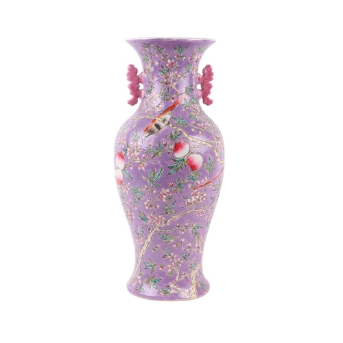 584 - A Chinese China Straights style vase of baluster form decorated birds and foliage on a purple ground... 