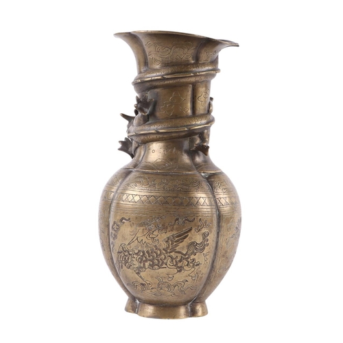 586 - A Chinese brass Gu vase with character mark to base, 24.5cms high, with hardwood wooden stand; toget... 