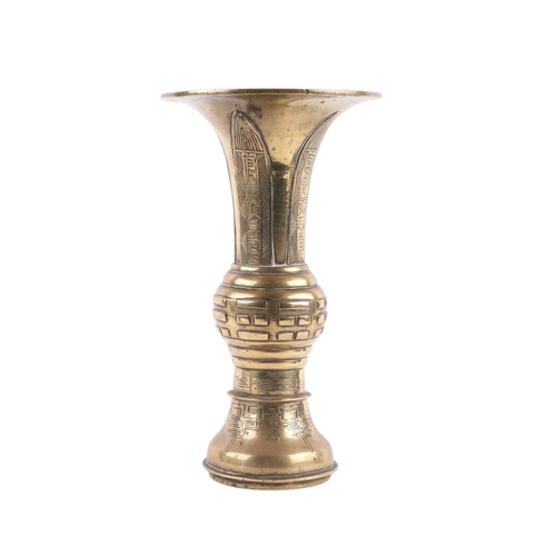 586 - A Chinese brass Gu vase with character mark to base, 24.5cms high, with hardwood wooden stand; toget... 