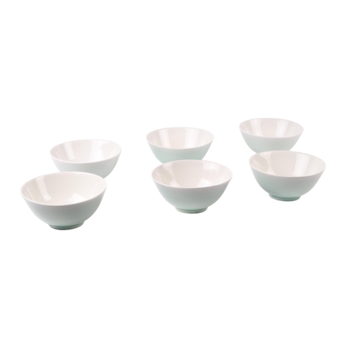 587 - A set of six Chinese celadon monochrome glaze rice bowls, 13cms diameter; together with various tea ... 