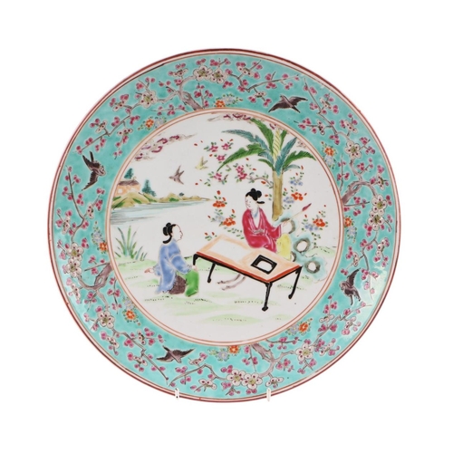 589 - A Chinese famille rose China Straits style plate, the central vignette decorated with a scholar and ... 