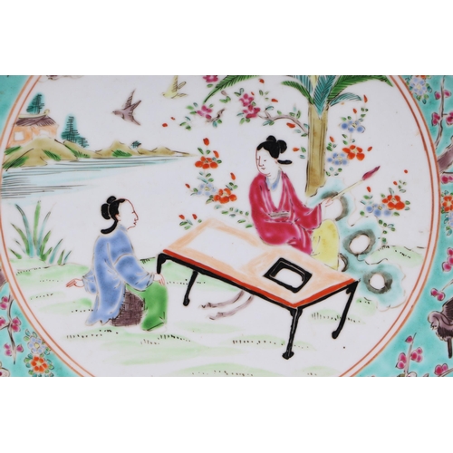 589 - A Chinese famille rose China Straits style plate, the central vignette decorated with a scholar and ... 