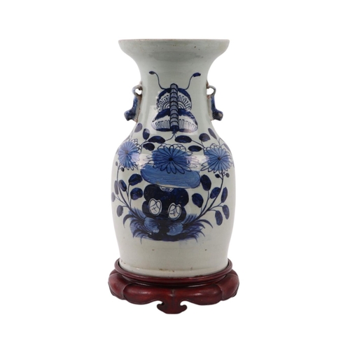 593 - A Chinese blue & white baluster vase with dog of fo handles, decorated with a butterfly within flowe... 