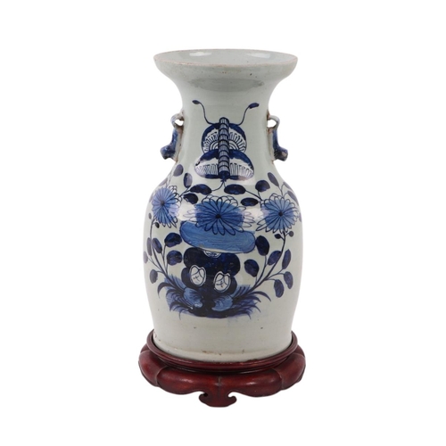 593 - A Chinese blue & white baluster vase with dog of fo handles, decorated with a butterfly within flowe... 