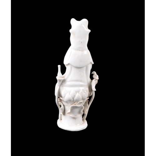 596 - A Chinese blanc de chine figure depicting Guanyin, 22cms high.