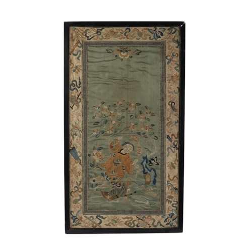 598 - A Chinese silk embroidered panel depicting Liu Hai Chan standing on a three legged toad with auspici... 