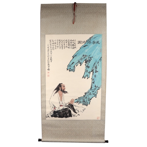 608 - A Chinese scroll painting depicting a sage and calligraphy, overall 75 by 164cms.