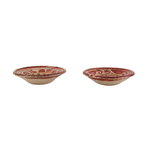 61 - A pair of Hispano Moresque lustre pottery bowls, each approx 18.5cms diameter (2).