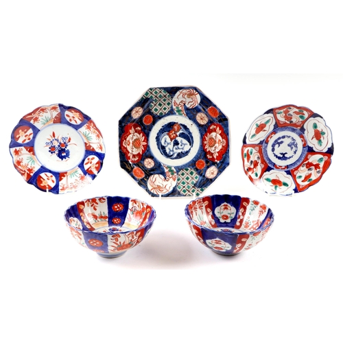 611 - A Japanese octagonal Imari charger, 26cms diameter; together with two Imari plates, largest 22cms di... 