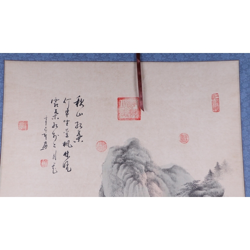 612 - A Chinese scroll depicting a mountainous landscape scene with calligraphy, 62 by 127cms.