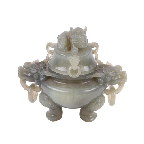 616 - A Chinese figured green hardstone censer with lion mask handles and fo dog finial, 15cms high.