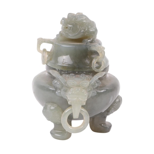 616 - A Chinese figured green hardstone censer with lion mask handles and fo dog finial, 15cms high.