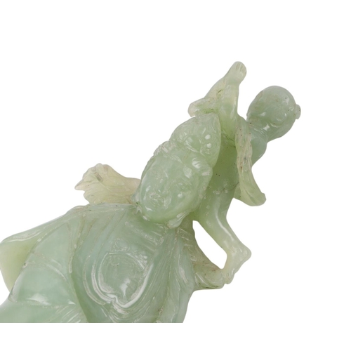 617 - A figured green hardstone figure depicting Guanyin, 24cms high.