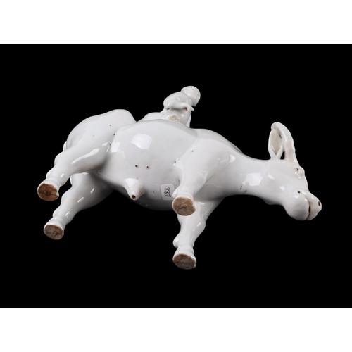 620 - A Chinese blanc de chine group depicting a young boy riding an oxen, 16cms high.