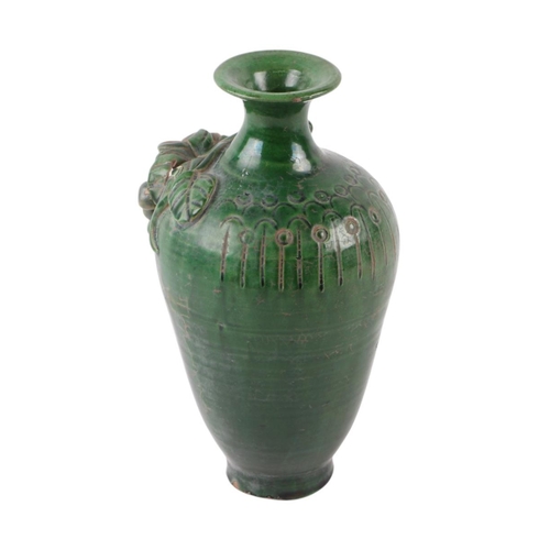 622 - A Chinese green glazed pottery vase decorated with grapes and vine, 17cms high.