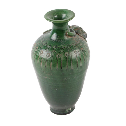 622 - A Chinese green glazed pottery vase decorated with grapes and vine, 17cms high.