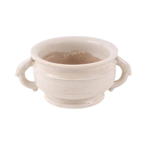 623 - A Chinese blanc de chine two-handled censer with archaic decoration, 11.5cms diameter.