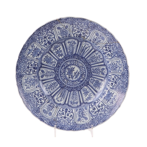 624 - A large Chinese blue & white shallow bowl decorated with flowers, 41cms diameter (restored).